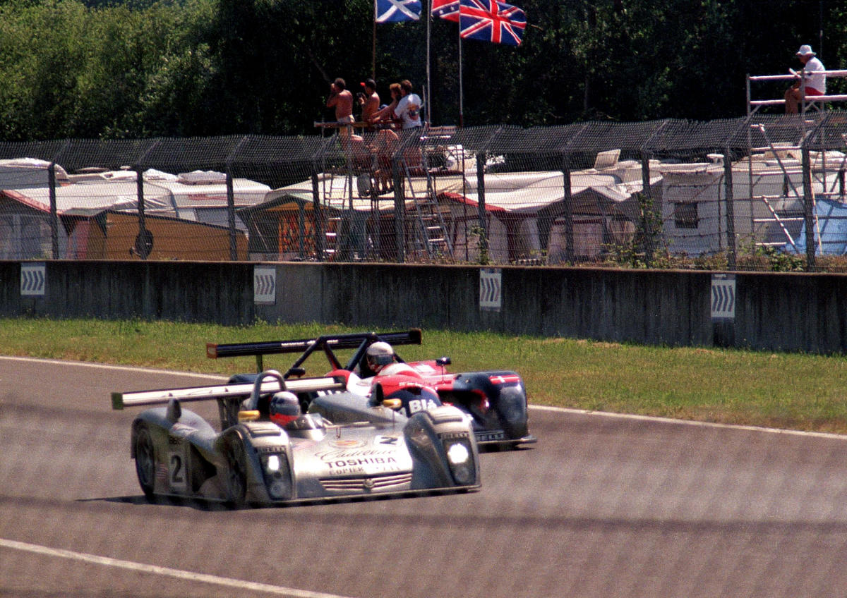 Cadillac Northstar LMP - Wayne Taylor, Eric van de Poele & Max Angelelli leads Panoz LMP-1 Roadster S - John Nielsen, Klaus Graf & Mauro Baldi heading for Ford Chicane at the 2000 Le Mans (52532975237).jpg
